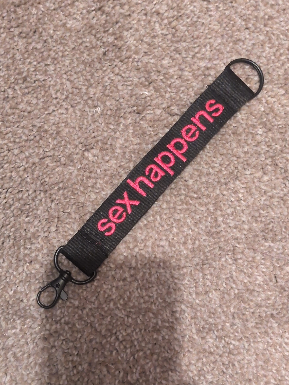Black Julie Keychain Strap with Pink "sex happens" Embroidery